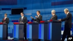 Republican presidential candidates, from left to right: Texas Gov. Rick Perry; former Pennsylvania Sen. Rick Santorum; former Massachusetts Gov. Mitt Romney; former House Speaker Newt Gingrich; and Rep. Ron Paul, R-Texas take part in the South Carolina Re