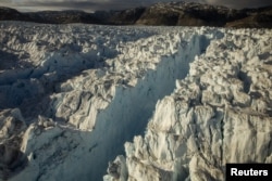 A large crevasse forms near the calving front of the Helheim glacier near Tasiilaq, Greenland, June 22, 2018. REUTERS/Lucas Jackson