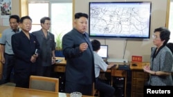 FILE - North Korean leader Kim Jong Un gives field guidance to the Hydro-meteorological Service.