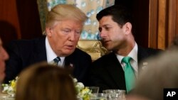 FILE - President Donald Trump talks with House Speaker Paul Ryan on Capitol Hill, March 16, 2017. Trump has told fellow Republicans to pass their health care bill Friday or the Affordable Care Act will stay in place.