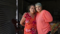 Iris Franco, right, hugs her mother, Elsa Victorina Franco, at her home, in El Ranchador, Santa Ana, El Salvador, Friday, March 5, 2021.