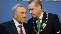 Turkey's Prime Minister Recep Tayyip Erdogan, right, and Kazakh President Nursultan Nazarbayev seen during a press conference in Ankara, October 11, 2012.