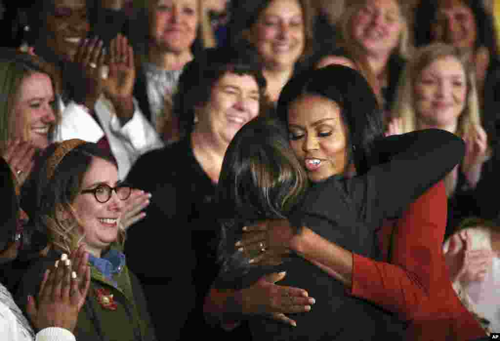 Michelle Obama hugs 2017 School Counselor of the Year Terri Tchorzynski, after her final speech as first lady at the 2017 School Counselor of the Year ceremony in the East Room of the White House in Washington.