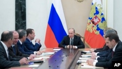Russian President Vladimir Putin chairs a Security Council meeting in the Kremlin in Moscow, Russia, Jan. 13, 2017. A U.S. intelligence report released last week said Putin ordered a hidden campaign to influence the U.S. presidential election. 