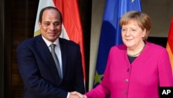 German Chancellor Angela Merkel welcomes Egyptian President Abdel-Fattah el-Sissi for a bilateral meeting during the Munich Security Conference in Munich, Germany, Feb. 16, 2019.