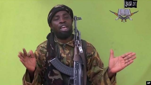 FILE - This image taken from video released by Boko Haram militants in Nigeria in May 2014 shows leader Abubakar Shekau, the group's most prominent leader.