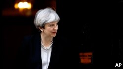 FILE - Britain's Prime Minister Theresa May is seen at 10 Downing Street in London, April 19, 2017.