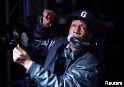 FILE - Hip-hop DJ Grandmaster Flash speaks at a ceremony where he is inducted into Guitar Center's RockWalk in Los Angeles, March 6, 2014.