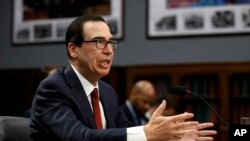 FILE - Treasury Secretary Steven Mnuchin testifies before a House Appropriations subcommittee on Capitol Hill in Washington, April 9, 2019..