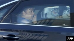 German Chancellor Angela Merkel speaks on her mobile phone as she arrives at the German Christian Democrats headquarters in Berlin on July 2, 2018. Merkel recently called Saudi Crown Prince Mohammed bin Salman in a bid to ease tensions between the two countries.