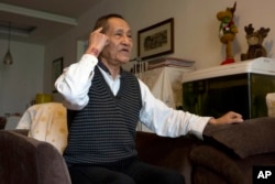 FILE - Bao Tong, aide to the late reform-minded former Communist Party general secretary, Zhao Ziyang, speaks from his home in Beijing, China, April 23, 2014.