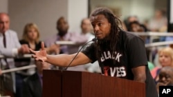 FILE - Muhiyidin d'Baha, whose legal name was Muhiyidin Elamin Moye, speaks during a meeting with North Charleston city council in North Charleston, S.C., April 9, 2015. 