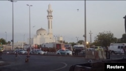 General view of security personnel in front of a mosque as police stage a second controlled explosion, after a suicide bomber was killed and two other people wounded in a blast near the U.S. consulate in Jeddah, Saudi Arabia, July 4, 2016.