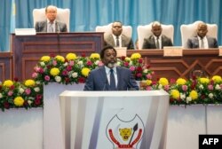 FILE - The president of the Democratic Republic of the Congo, Joseph Kabila, delivers a state-of-the-nation speech at parliament in Kinshasa, July 19, 2018.
