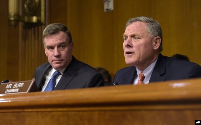 Senate Intelligence Committee Chairman. Sen. Richard Burr, R-N.C., right, joined by Vice Chairman Sen. Mark Warner, D-Va., left, speaks at the Senate Intelligence Committee hearing on Capitol Hill in Washington, March 30, 2017.