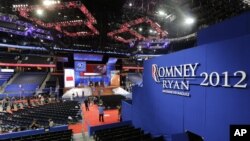 Workers prepare the stage for the Republican National Convention inside the Tampa Bay Times Forum in Tampa, Florida, Aug. 25, 2012. 