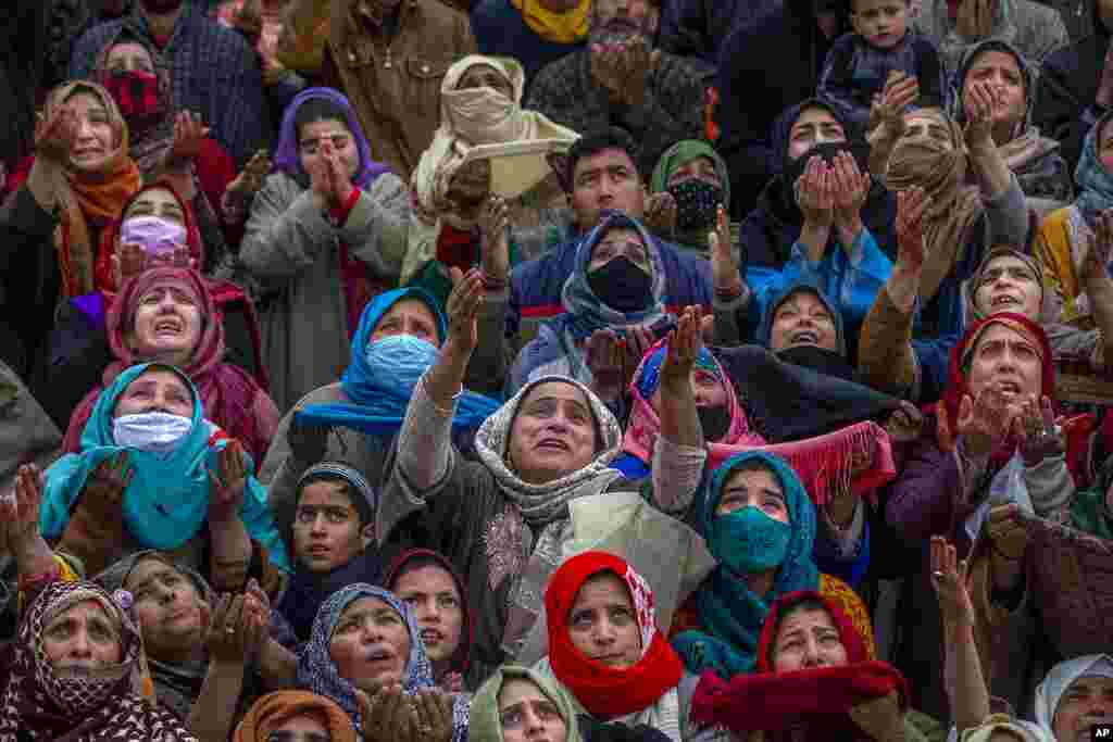 Kashmiri Muslim women pray as the head priest shows a relic at the Hazratbal shrine on Mehraj-u-Alam, believed to mark the rising of Prophet Muhammad to heaven, in Srinagar, Indian-controlled Kashmir.