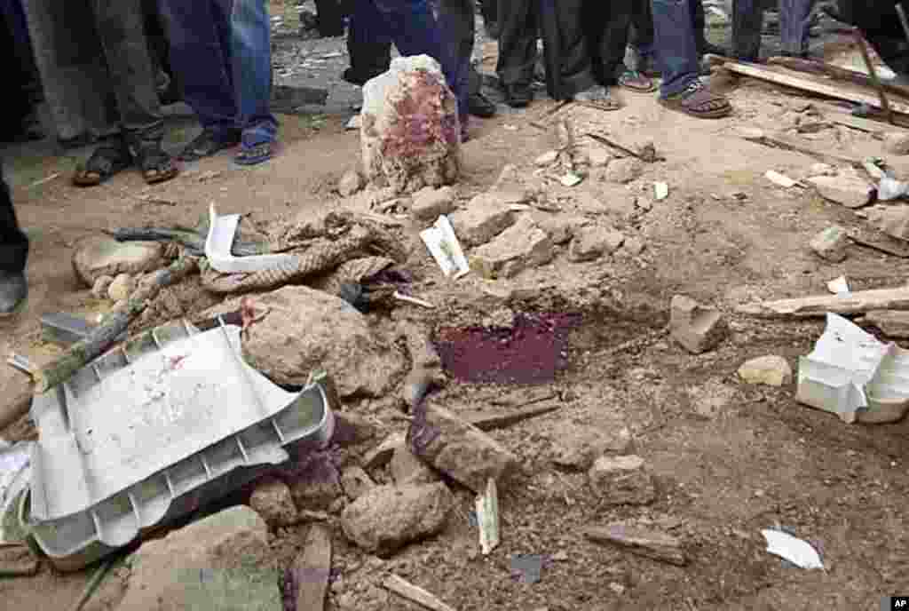 Blood stains the ground at a church, the site of a bomb blast, in Nigeria's central city of Jos February 26, 2012.