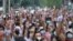 Anti-coup protesters raise decorated Easter eggs along with the three-fingered symbols of resistance during a protest against the military coup on Easter Sunday, April 4, 2021, in Yangon, Myanmar. (AP Photo)