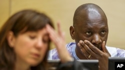Congolese warlord Thomas Lubanga is seen at his appeals hearing at the International Criminal Court in The Hague Dec. 1, 2014.