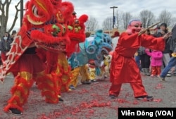 FILE - A dragon dance at Eden Center to celebrate the New Year of the Rooster