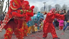 FILE - A dragon dance at Eden Center to celebrate the New Year of the Rooster