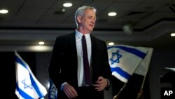 Retired Israeli general Benny Gantz, one of the leaders of the Blue and White party, prepares to deliver a speech during election campaigning in Ramat Gan, Israel, March 27, 2019. 