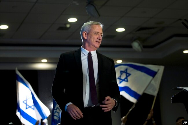 FILE - Retired Israeli general Benny Gantz, leader of the Blue and White party, prepares to deliver a speech in Ramat Gan, Israel, April 9. 2019.