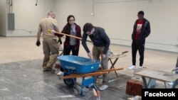 High school students from the Waterloo Community School District take part in construction traning at their school. The students spent five days at their school learning from experienced workers from the Masonry Institute of Iowa. (Masonry Institute of Io