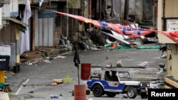 A view of the Maute group stronghold with an ISIS flag in Marawi City in southern Philippines May 29, 2017. 