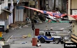 A view of the Maute group stronghold with an ISIS flag in Marawi City in southern Philippines May 29, 2017.