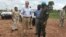 David Shearer, second left, the United Nations peacekeeping mission chief in South Sudan, visits the troubled region of Yei, South Sudan, July 13. 2017. Shearer says he's considering putting a permanent U.N. presence in the town, but only if the government grants unrestricted access.