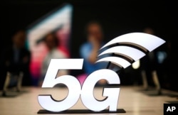 A banner of the 5G network is displayed during the Mobile World Congress wireless show, in Barcelona, Spain, Feb. 25, 2019.
