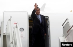 FILE - Cambodia's Prime Minister Hun Sen arrives at Phnom Penh International Airport before flying to China, in Phnom Penh, Cambodia, Nov. 29, 2017.