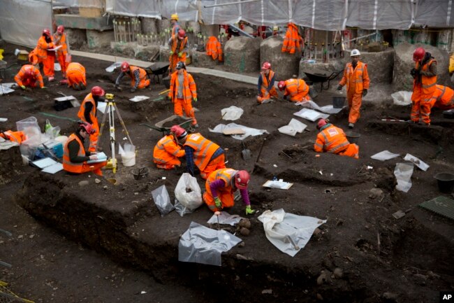 Archaeologists excavate the 16th and 17th century Bedlam burial ground uncovered by work on the new Crossrail train line next to Liverpool Street station in London, March 6, 2015.