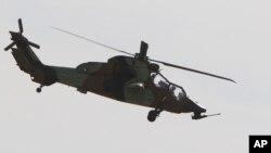 FILE - An Airbus Tiger helicopter photographed at the Bemowo airport in Warsaw, Poland, Aug. 27, 2015.