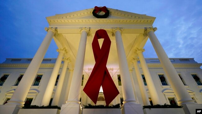 The White House in Washington is decorated to commemorate World AIDS Day, Dec. 1, 2021.