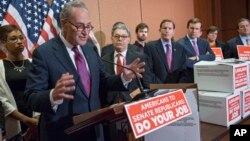 From left, Sen. Charles Schumer, D-N.Y., Sen. Al Franken, D-Minn., Sen. Richard Blumenthal, D-Conn., and Sen. Chris Murphy, D-Conn., talk to reporters on Capitol Hill in Washington about Senate Republicans' refusal to act on any Supreme Court nomination.