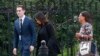 FILE - Kim Kardashian West, center, arrives with her attorney Shawn Chapman Holley at the security entrance of the White House in Washington, May 30, 2018.