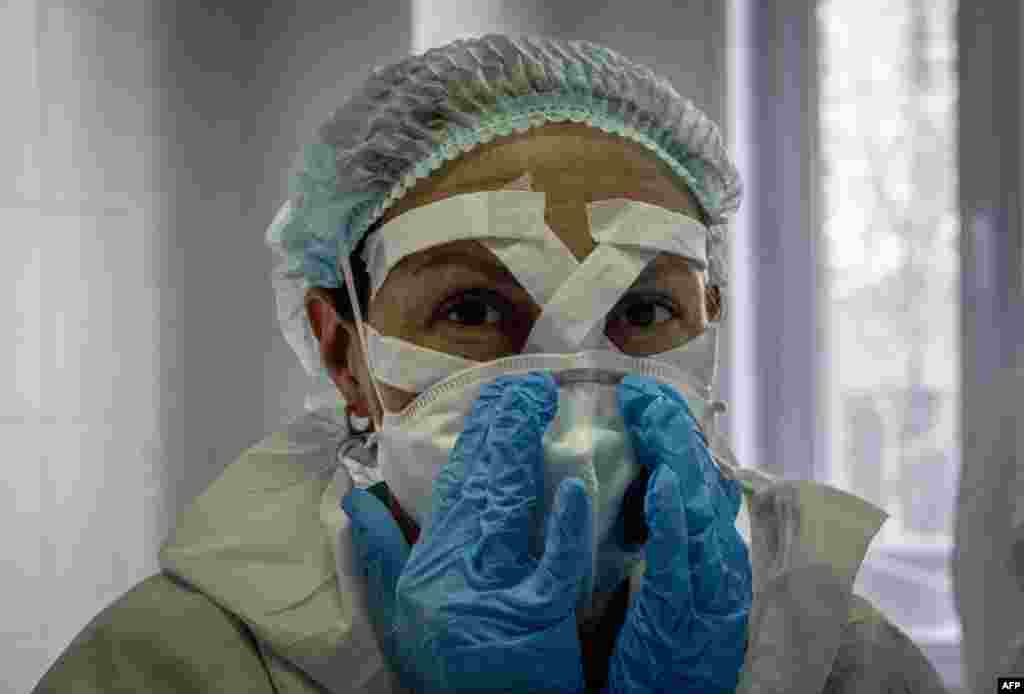 A medical worker gets ready for a shift treating coronavirus patients at the Spasokukotsky clinical hospital in Moscow, Russia, April 22, 2020.
