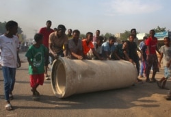 Sudanese protest against a military coup that overthrew the transition to civilian rule, in the al-Shajara district in southern Khartoumon, October 25, 2021.