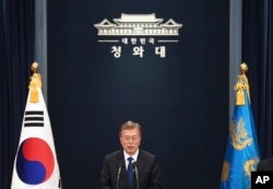 FILE - South Korea's new President Moon Jae-in speaks at the presidential Blue House in Seoul.