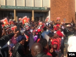 Some of the people who protested outside the Harare Magistrates' Courts following delays in bringing Job Sikhala to court.