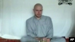 FILE - This video frame grab taken from a Taliban propaganda video released Saturday, July 18, 2009 shows Bowe Bergdahl, who disappeared June 30, 2009. 