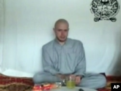 This video frame grab taken from a Taliban propaganda video released Saturday, July 18, 2009 shows Bowe Bergdahl, who disappeared June 30, 2009.