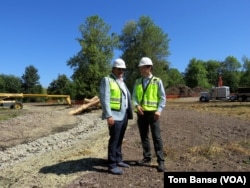 Aegis Living CEO Dwayne Clark (left) and development manager Brian Palmore at the future location of the Chinese-themed retirement home Aegis Gardens in Newcastle, Washington.