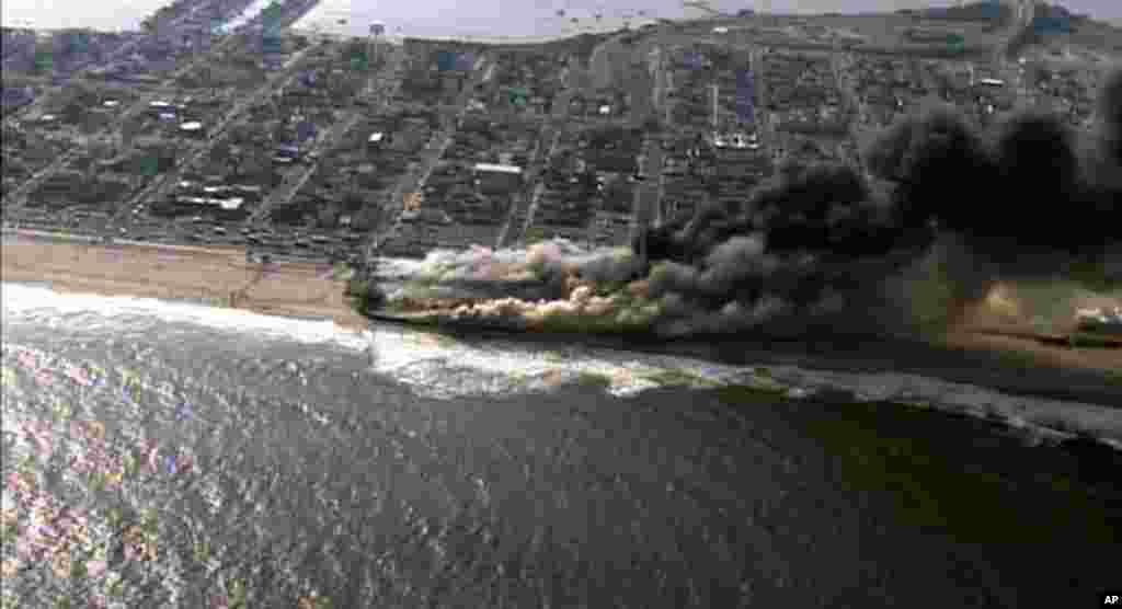 This frame grab from video provided by Fox 29 shows a raging fire in Seaside Park, New Jersey, Sept. 12, 2013. 