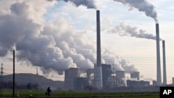 FILE - Coal burning power plants are the biggest source of carbon pollution, which is responsible for climate change.