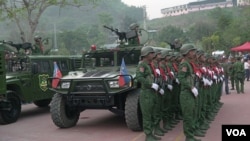 FILE - UWSA soldiers stand at attention during ceremonies in Phangsang, Shan state, Special Region 2, April 17, 2019. (Am Sandford/AsiaReports)