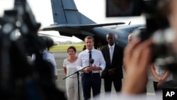 France's President Emmanuel Macron addresses the media upon his arrival in Pointe-a-Pitre, Guadeloupe island, the first leg of his trip to French Caribbean islands, Sept. 12, 2017.